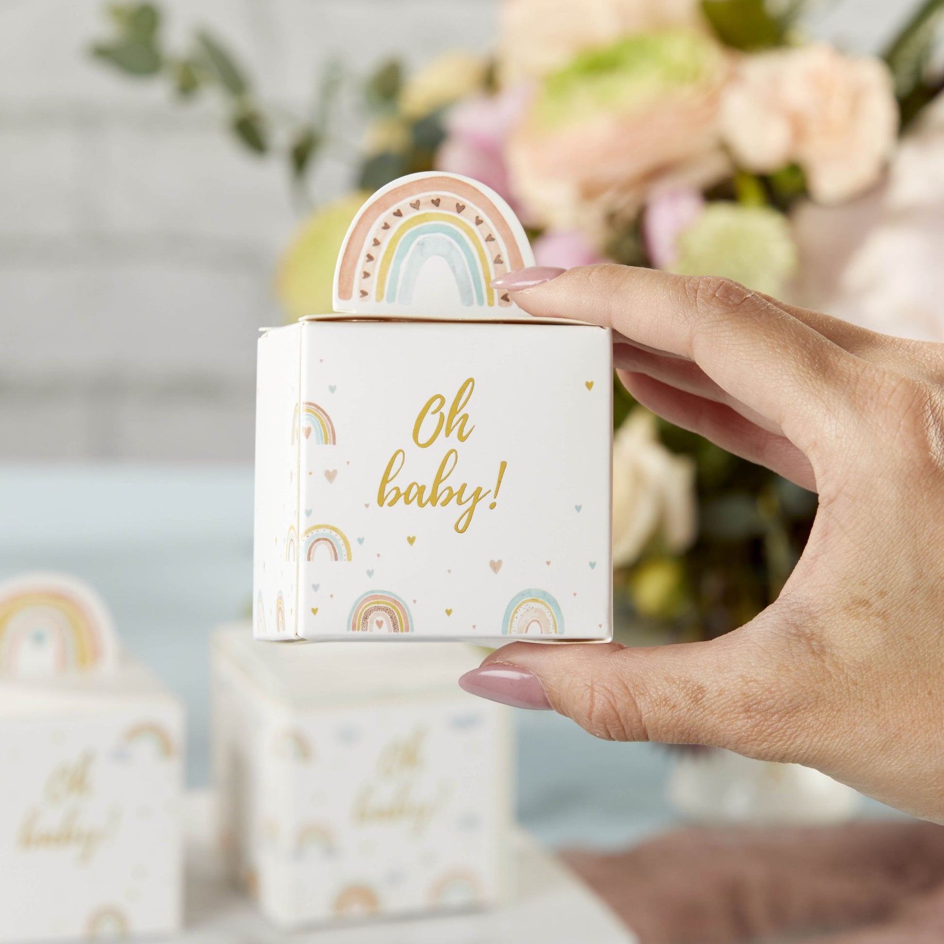 boho baby shower favor box shown in hand for scale
