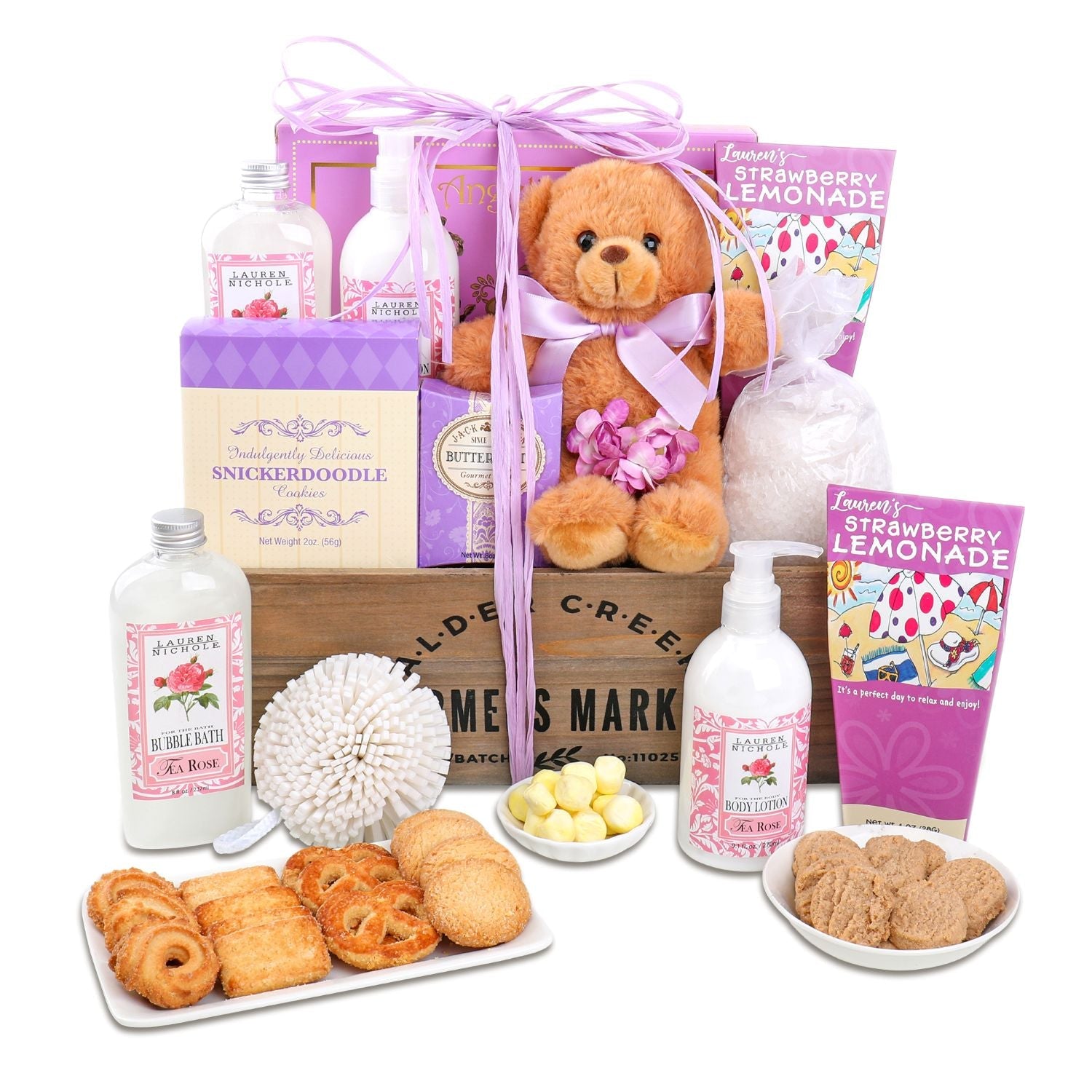 Gift basket with teddy bear, cookies, and bath products on a white background lavnder and purple accents